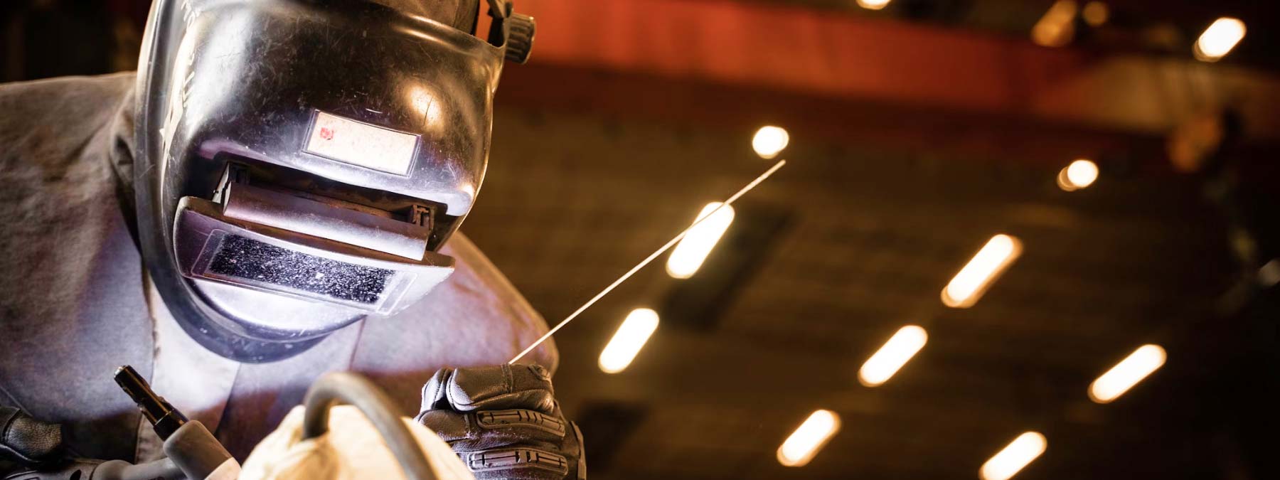 Man Wearing Welding Helmet Factory welding test