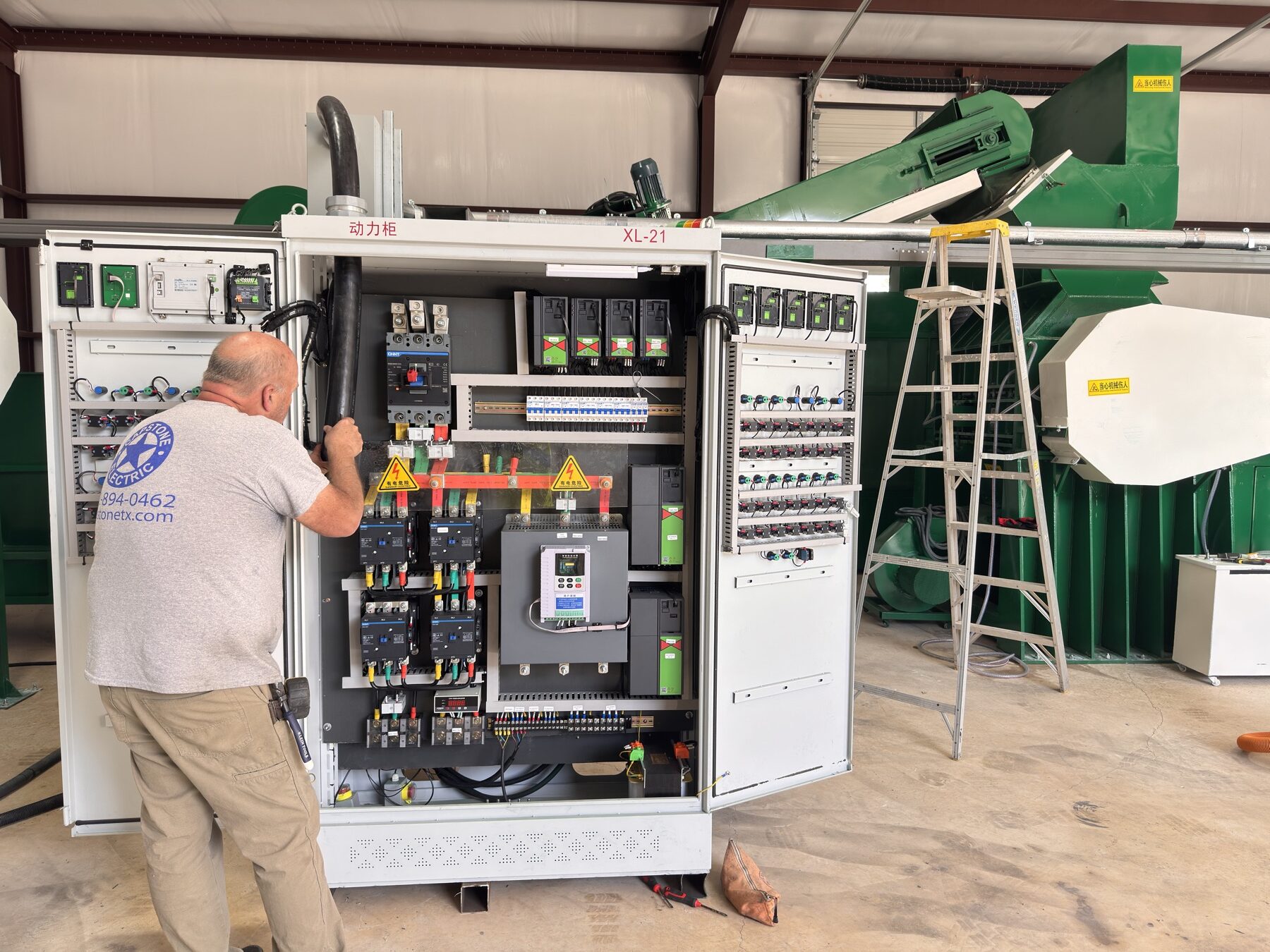 Technicians testing an industrial recycling line