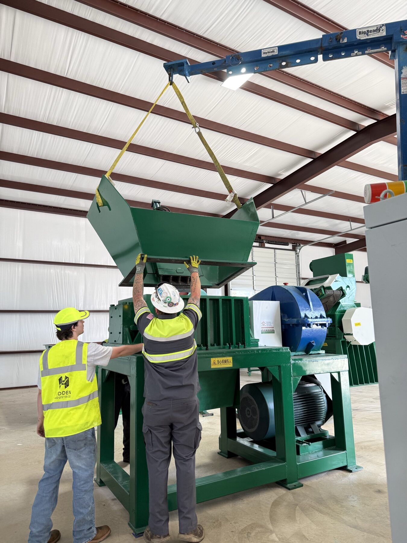 Industrial worker inspecting heavy machinery