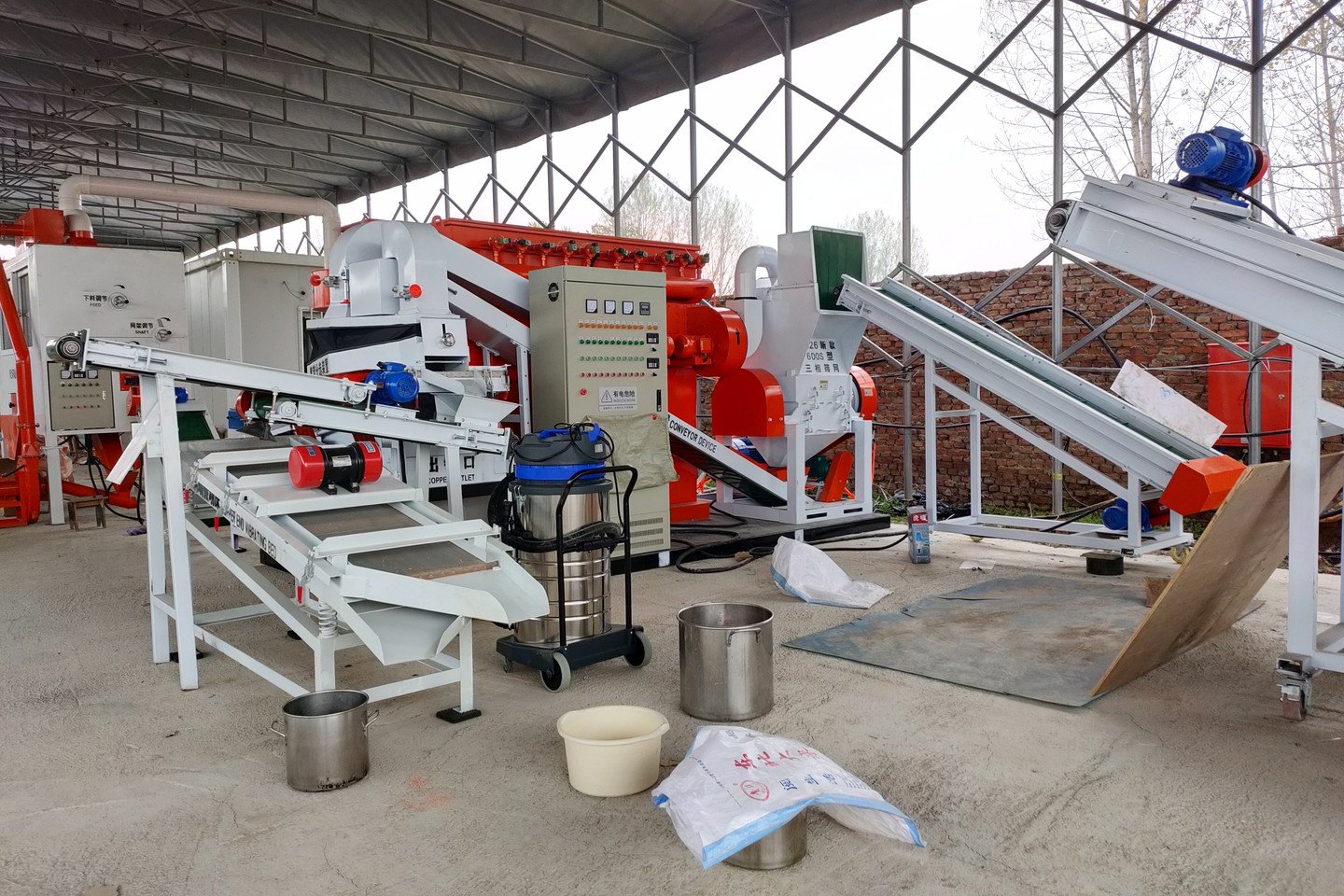 Industrial copper wire granulator machine frame showing cutting chamber, drive motor, and maintenance service access
