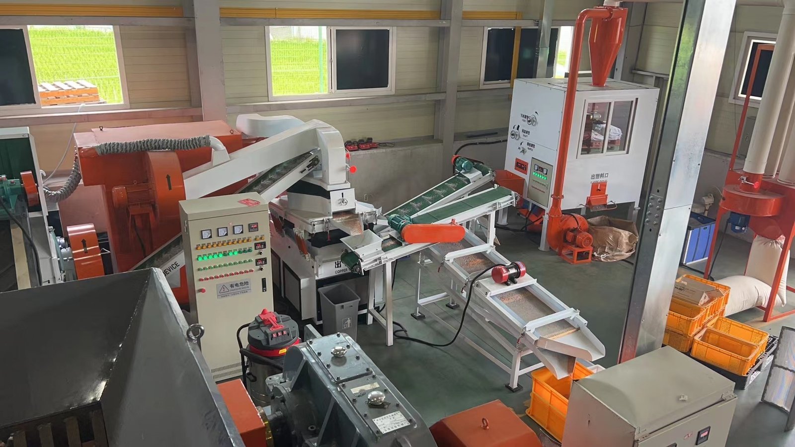 Complete MECUVO copper wire granulator system installed with infeed hopper, granulation mill, air separation table, and dust cyclone