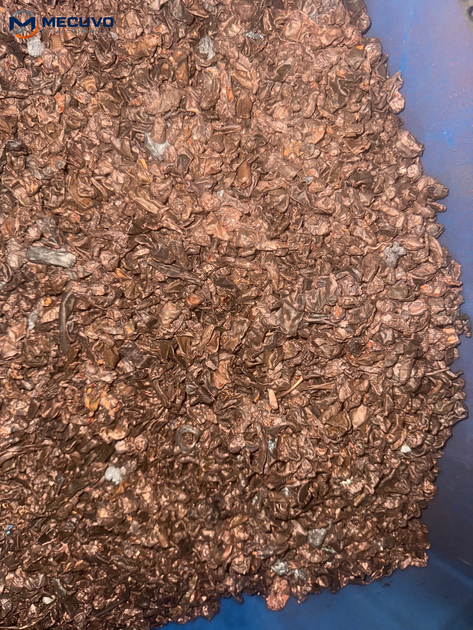 Recovered copper granules in a collection bag