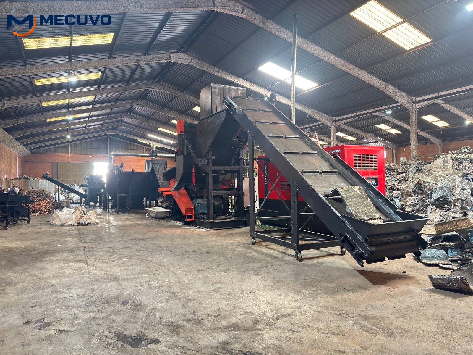 Radiator processing line and connected conveying equipment in a workshop Installed radiator recycling line with connected conveyors