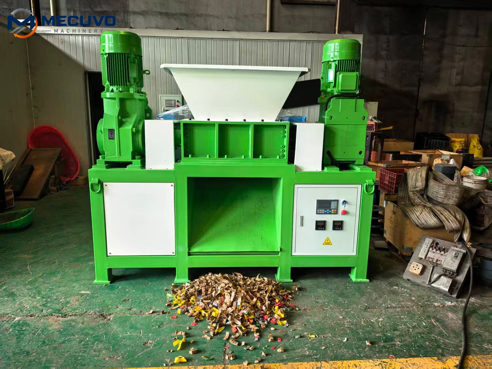 Shredder discharge area with size reduced material collected below
