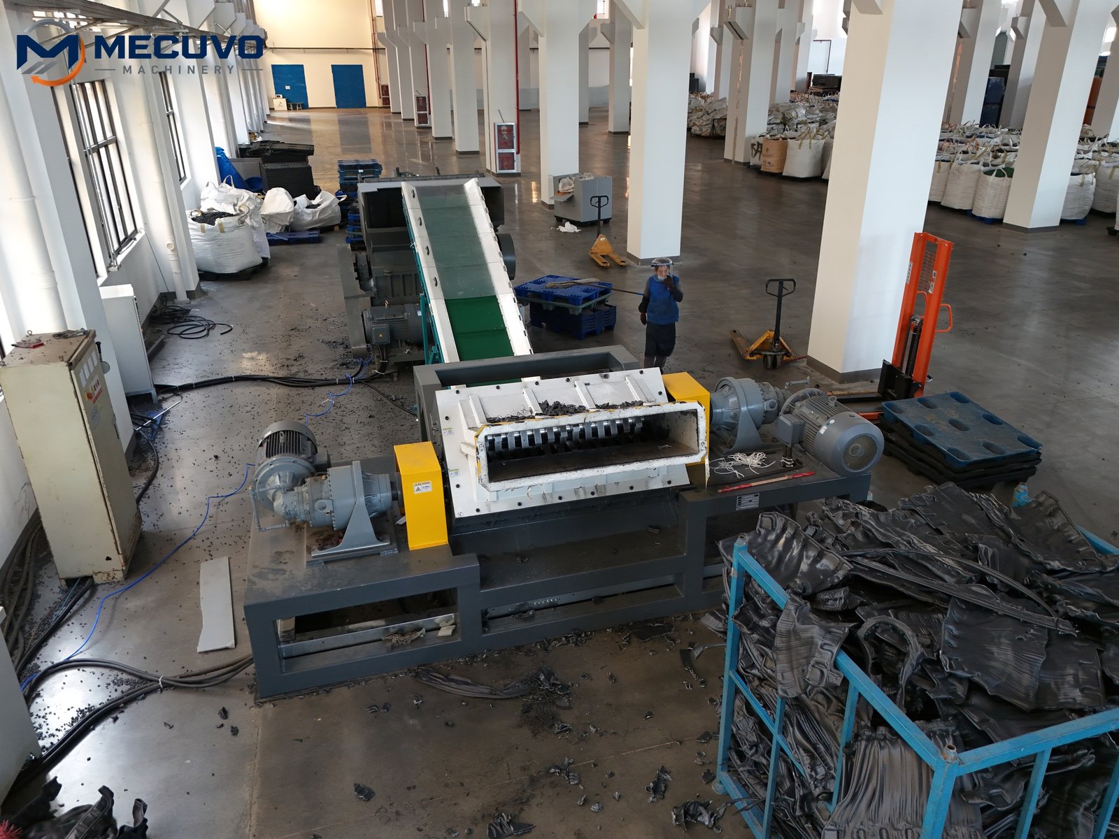 Installed shredding line with material and conveyors in a workshop